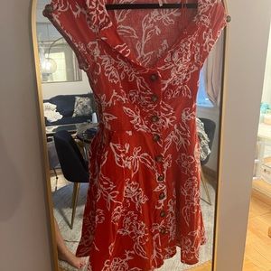 Flirty free people mini dress with pockets and back tie